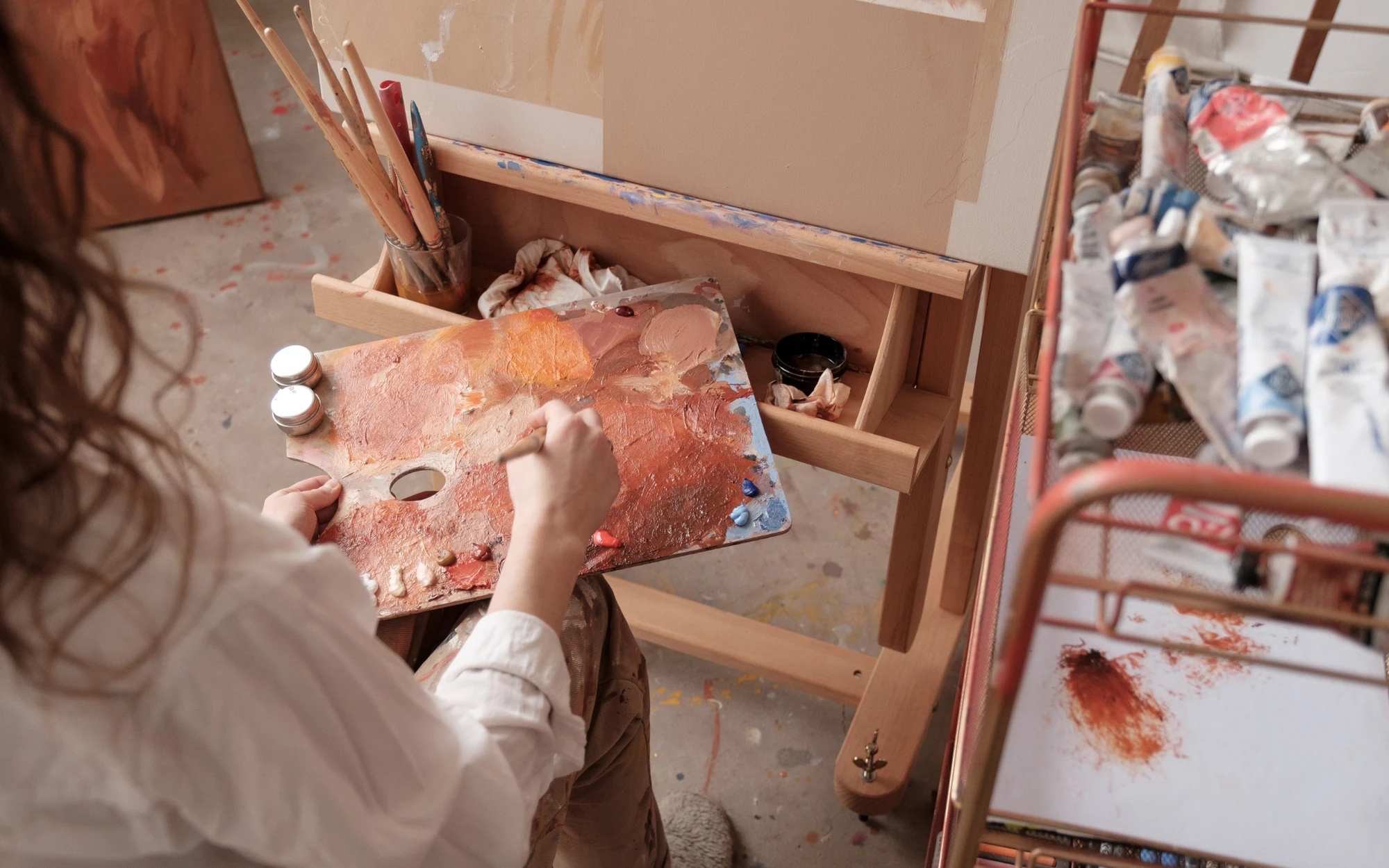Resident painting in the Ombelle arts and crafts studio
